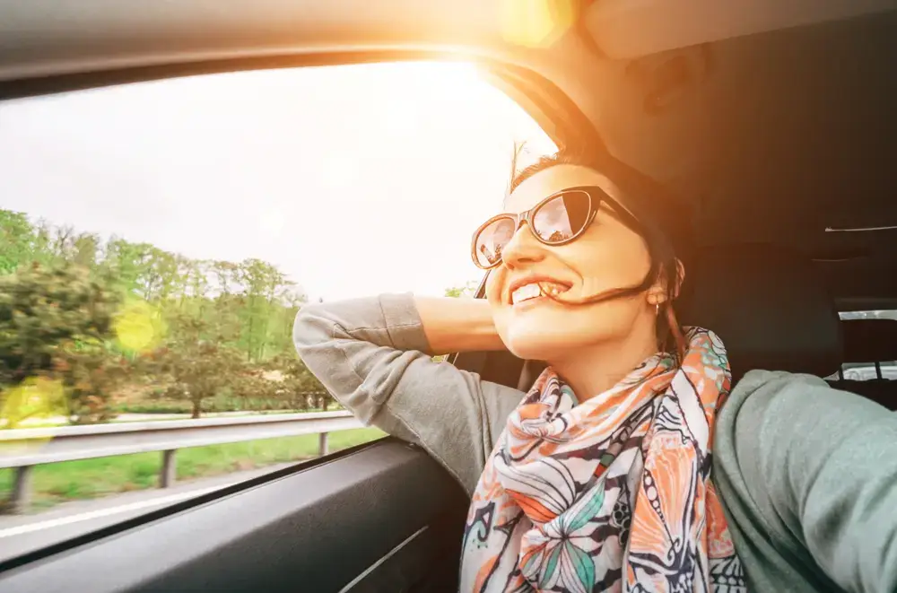 A woman dreaming about her new car